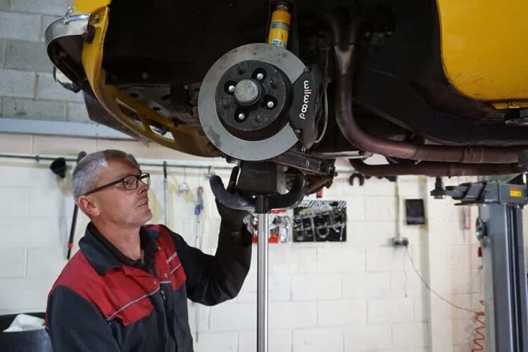 Mechanic fitting Polybush Polyurethane Suspension Bushes to an MG BGT