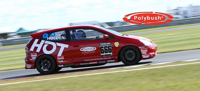 A red Vauxhall racing car with number 666 and multiple sponsor logos, including "polybush," speeding on a racetrack with a clear blue sky in the background.
