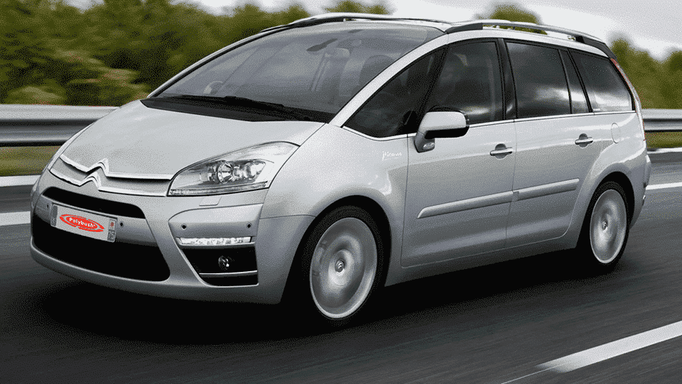 A silver citroën picasso people carrier on a motorway, displaying motion blur on the road to suggest speed, under a cloudy sky.