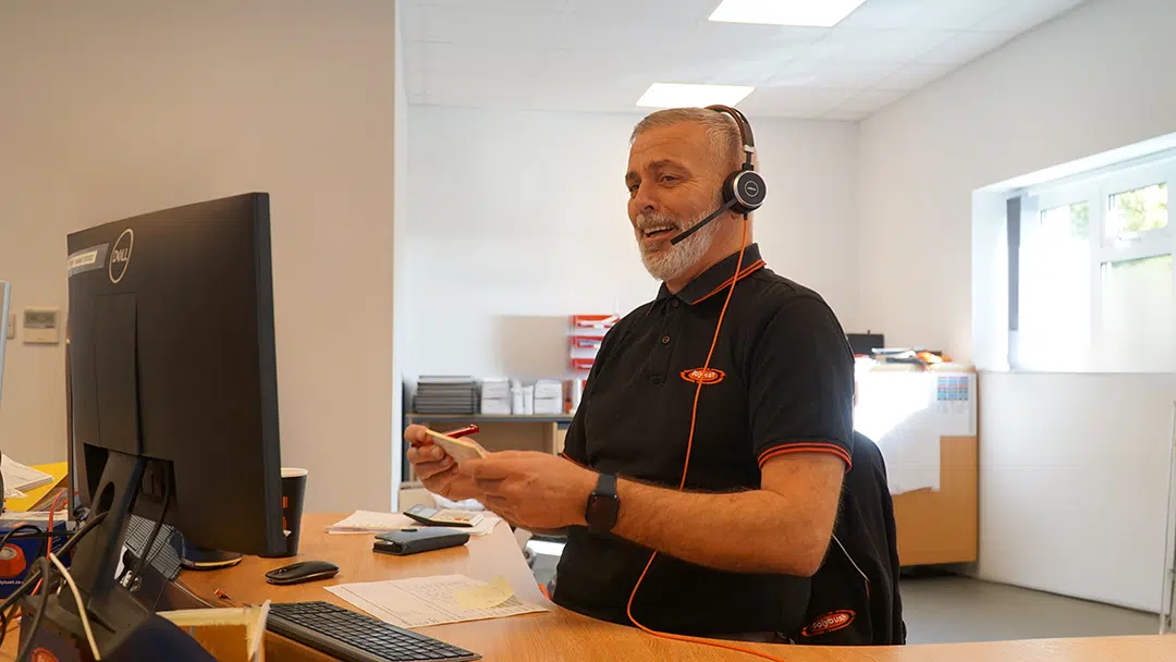 Justin Answering the phone - Asset